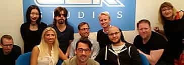 People at a conference table in the ELK Studios head office in Stockholm, Sweden