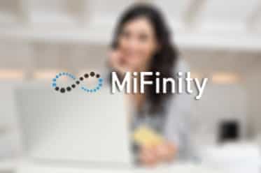 The MiFinity logo displayed on a background of a woman using a laptop and holding a card.