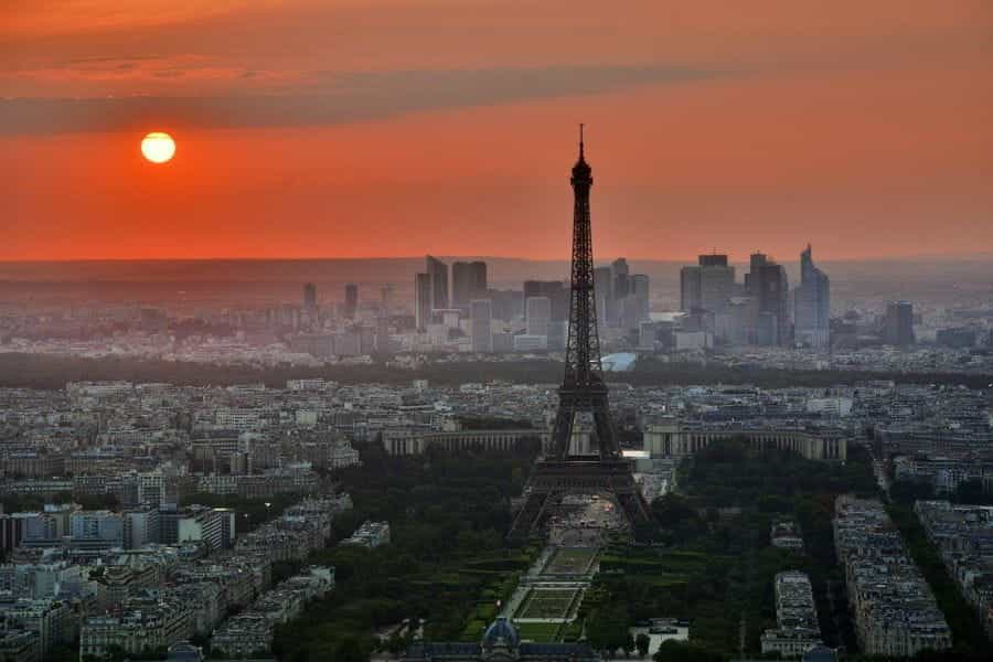 The sun setting over the Eiffel Tower in Paris.