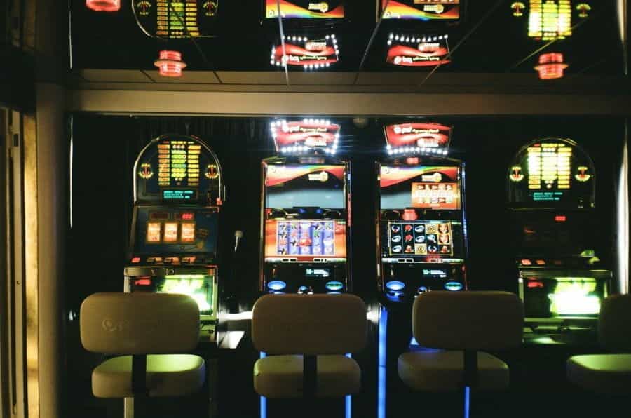 Three slot machines in a betting shop.