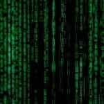 A black computer screen with green matrix style letters.