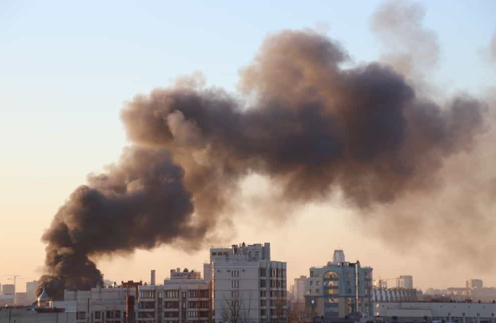 City scape and smoke rising.