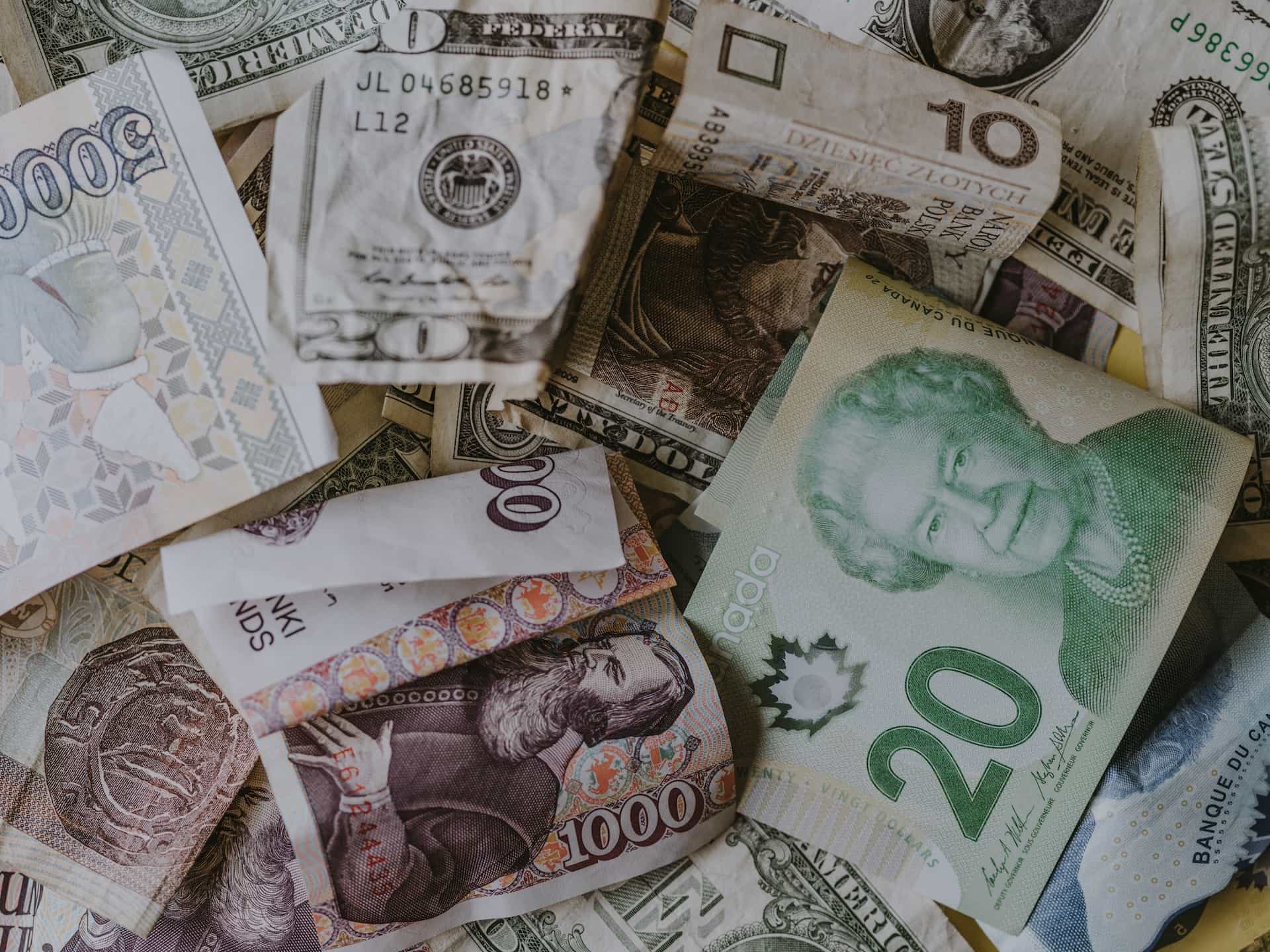 An assortment of bills from different currencies.