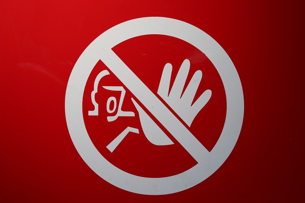 A red stop or halt sign.